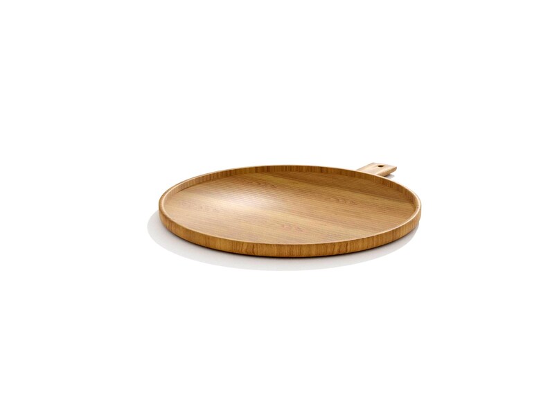 May include: A round, wooden serving tray with a handle. The tray is made of light brown wood and has a smooth surface. The handle is rectangular and attached to the side of the tray. Ideal for serving food or displaying items.