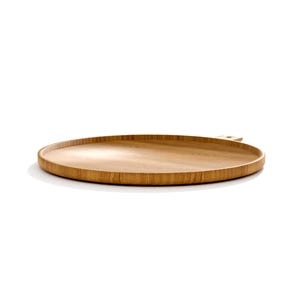 May include: A round, wooden serving tray with a natural wood grain finish. The tray has a slightly raised edge and a small handle. The tray is made of light brown wood and is set against a white background.