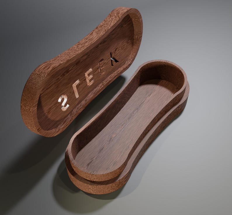 May include: A wooden box with a curved, oblong shape, featuring a lid with the word "2GEEK" carved into it. The box is open, revealing the interior. The wood has a warm, brown tone.