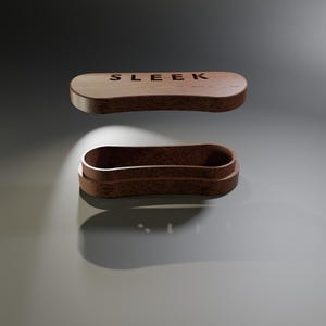 May include: A wooden, oval-shaped box with the word "SLEEK" engraved on the lid. The box is open, revealing the interior. The wood has a warm, brown tone, and the design is minimalist and modern.