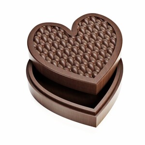 May include: A heart-shaped wooden box, open to reveal a layer of chocolate candies. The candies are small, oval-shaped, and a rich brown color. The box is made of dark wood and has a smooth finish.