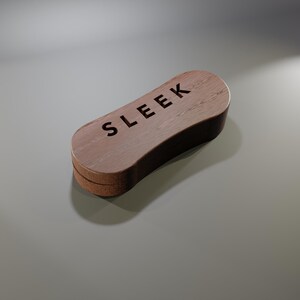 May include: A wooden shoe brush with the word "SLEEK" engraved on the top. The brush has a curved, rectangular shape with a light brown wooden finish and a darker brown edge.
