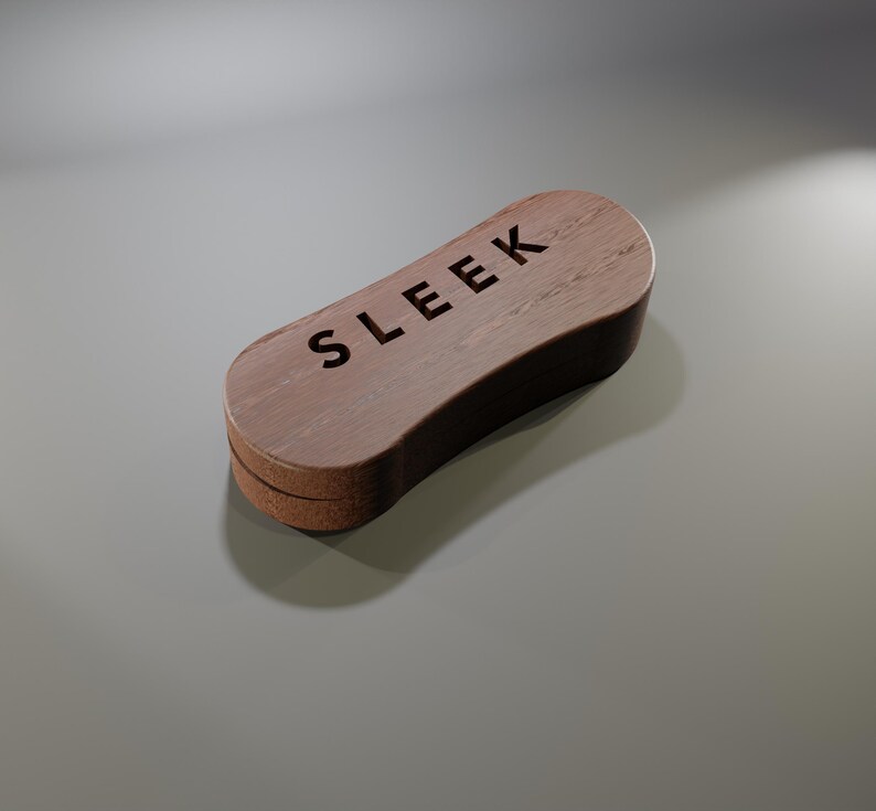 May include: A wooden shoe brush with the word "SLEEK" engraved on the top. The brush has a curved, rectangular shape with a light brown wooden finish and a darker brown edge.