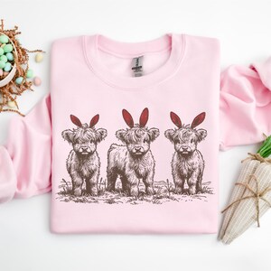 Easter Highland Cow Sweatshirt, Cute Easter Cow Shirt, Bunny Ear Cow Shirt, Funny Easter Gift For Men Women & Kids, Easter Western Shirt