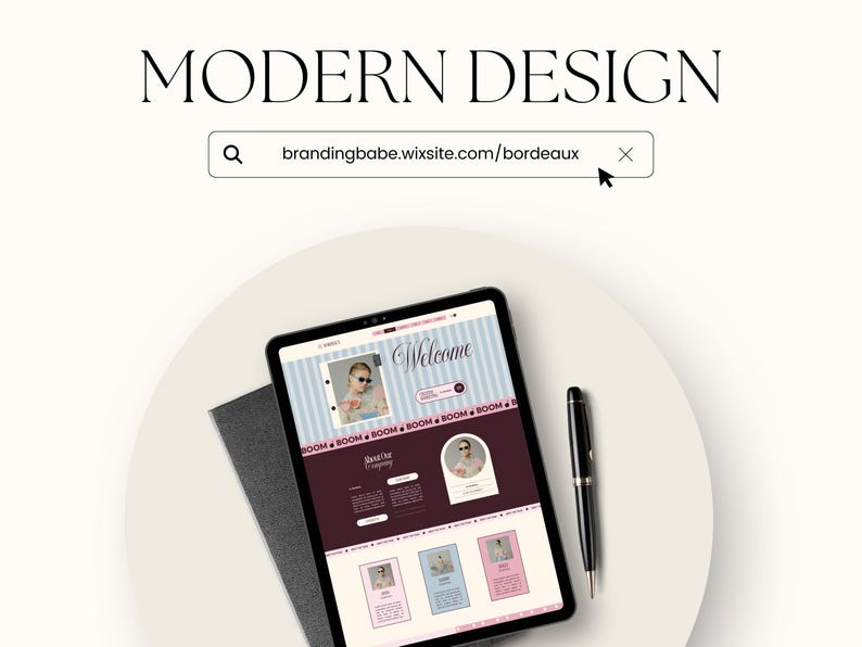 May include: A tablet displaying a website with the text MODERN DESIGN and a search bar containing brandingbabe.wixsite.com/bordeaux. The screen shows a layout with a welcome section, photos, and text blocks in shades of blue, pink, and dark maroon.