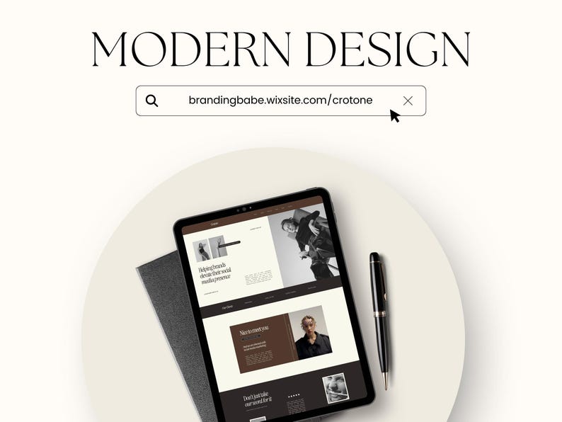 May include: A tablet computer displaying a website with the text "brandingbabe.wixsite.com/crotone" in the address bar. The website features images of people and text about their social media presence. The tablet is on a white surface with a black notebook and a black pen.
