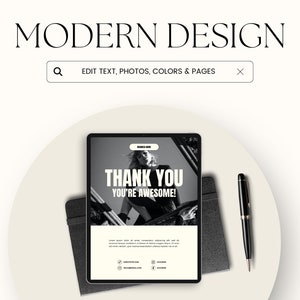 May include: A black and white image of a woman on a tablet screen with the text "THANK YOU YOU'RE AWESOME!" The tablet is on a white surface with a black pen and a black notebook.