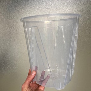 Image of Clear plastic pot with wire frame