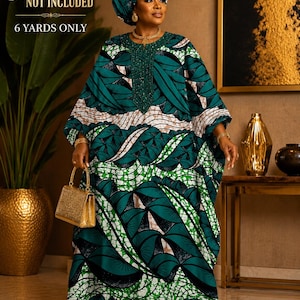 May include: A green and white patterned fabric with a leaf design. The fabric is made up of 6 yards. The text "Garment NOT INCLUDED" is visible in the image.