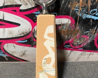 Recycled skateboard bottle opener
