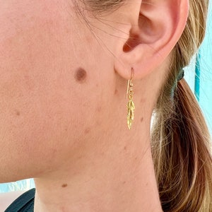 Gold feather earring