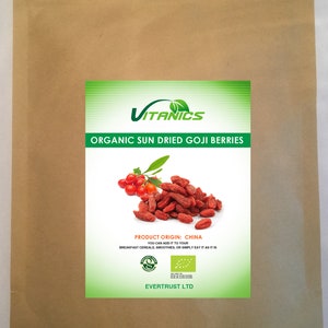 May include: A brown paper bag with a label that reads "VITANICS ORGANIC SUN DRIED GOJI BERRIES". The label also features an image of goji berries, the product origin, and the company name "EVERTRUST LTD".