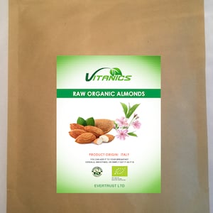 May include: A brown paper bag with a label that says "VITANICS RAW ORGANIC ALMONDS". The label also includes a picture of almonds, a flower, and the text "PRODUCT ORIGIN: ITALY YOU CAN ADD IT TO YOUR BREAKFAST CEREALS, SMOOTHIES, OR SIMPLY EAT IT AS IT IS EVERTRUST LTD".