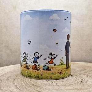 May include: A ceramic mug with a whimsical illustration of children running and playing. The design features a blue sky with clouds, hearts, and a figure of an adult watching the children. The mug has a blue rim and a light-colored background.