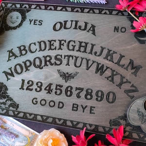 Ouija board from wood, classic spirit board Ouija, Occult practice, Spirit game for talking to the souls of the dead, Witchcraft decor
