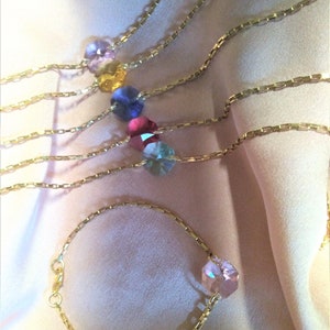 Bracelet gold-plated with Swarovski crystal in 7 colors or gold-plated with freshwater pearl, flower or heart.