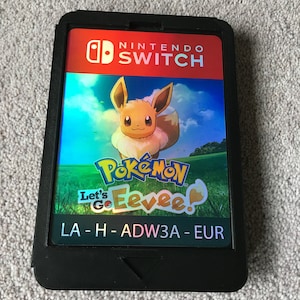 巨大サイズの Nintendo Switch ポケモン Let's Go Eevee カートリッジ。ゲームルームの壁の装飾/ディスプレイに必須のアイテムです。全部捕まえよう!