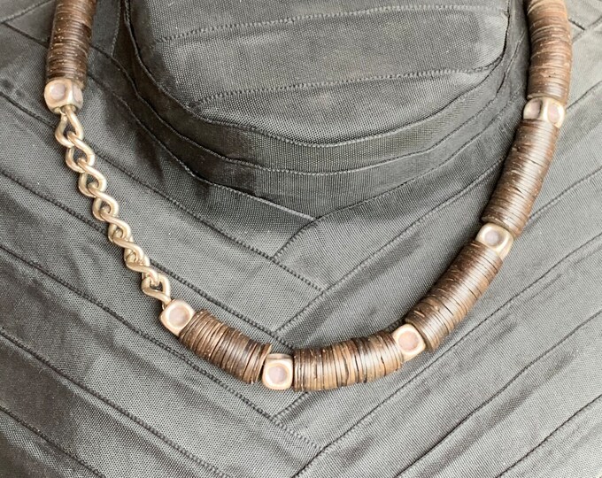 Necklace with silver parts and coconut flakes