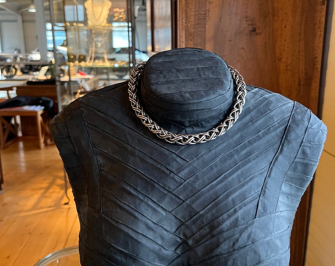 Silver chain intertwined with large links
