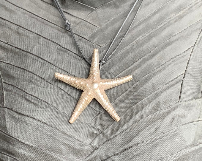 Silver starfish pendant on textile cord
