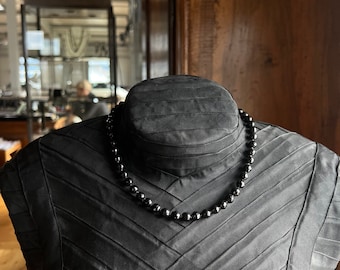 Black spinel with silver