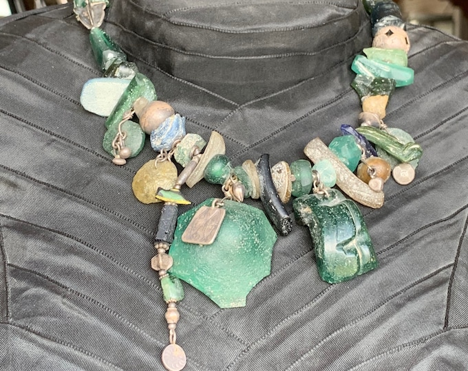 Excavation of old glass with antique silver parts (collector's item)