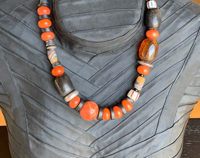 Designer necklace with apple coral, chevron, coconut plates and silver parts