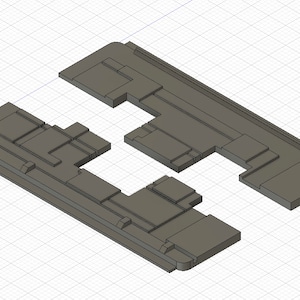 May include: A 3D model of a grey, rectangular object with a complex, segmented design. The object appears to be made of multiple interlocking pieces.