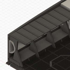 May include: A black metal structure with a series of rectangular openings and a black metal grate floor. The structure has a series of black metal panels that can be raised or lowered to cover the openings.