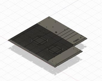 Puede incluir: Una placa de metal gris con dos recortes circulares y una superficie texturizada. La placa está unida a una placa de metal gris más pequeña con una serie de recortes rectangulares.