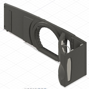 May include: A 3D model of a black and grey object with a large circular opening. The object has a complex design with multiple curves and angles. It appears to be part of a larger machine or structure.
