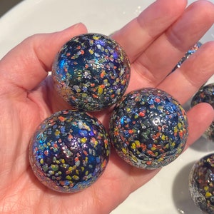 One “Glitterbomb” Mega Marble Glass Marbles, 1 3/8” (35mm), Large Boulder Marble, Purple Blue Iridescent with Rainbow Frit