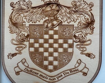 May include: A wooden plaque with a coat of arms featuring a chequered shield, a lion, and a helmet. The text "DuBose mais non pas Du Bosc" and "DuBose" is engraved on the plaque.