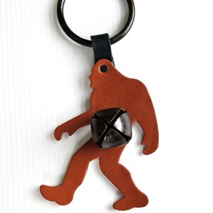 Sasquatch Leather Door Hanger with Primitive Bell, Big Foot, Rustic Cabin Decor
