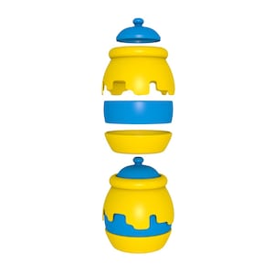 Puede incluir: Un tarro de miel amarillo y azul con tapa, separado en sus partes individuales. El tarro está decorado con un diseño de miel goteando.