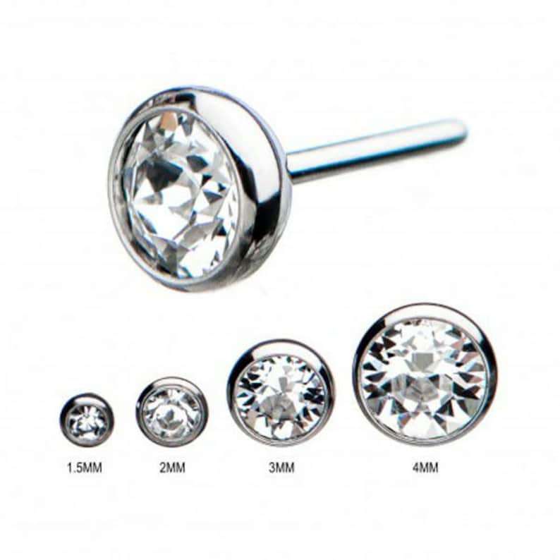 May include: Four sizes of clear crystal prong-set body jewelry, in 1.5mm, 2mm, 3mm, and 4mm sizes. The jewelry is made of surgical steel and is suitable for a variety of piercings.