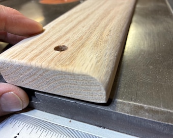 One red oak slat, 3/4” x 2-1/2” x 48”, rounded edges, w/heavy roundover on one edge, mounting holes, no varnish.  Shipping included.