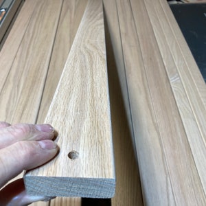 Red Oak slats, 5 pieces at 3/4” x 2-1/2” x 48”, 5/16” Dia holes 3/4” from each end, centered, rounded edges