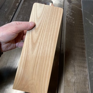 One ash board @ 3/4” x 4” x 11”, 1/8” roundover on long edges,  roundover and corner rounding on one end.  Msg us for custom dimensions.