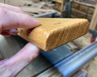 One red oak slat, 3/4” x 2-1/2” x 48”, rounded edges, w/heavy roundover on one edge, mounting holes, and outdoor varnish.  Shipping included