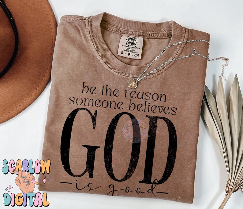 May include: A brown t-shirt with the text "be the reason someone believes GOD -is good- "
