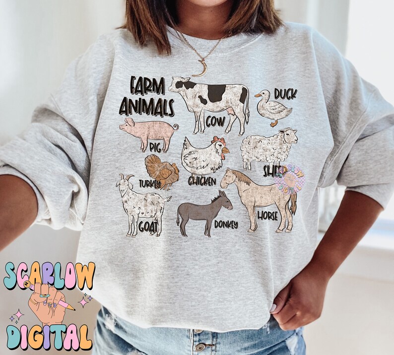 May include: A gray sweatshirt with the text "Farm Animals" printed on the front. The design features illustrations of a cow, pig, duck, sheep, turkey, chicken, goat, donkey, and horse.