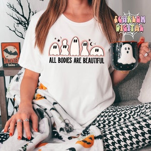 May include: White t-shirt with a line of five cartoon ghosts and the text "ALL BODIES ARE BEAUTIFUL".