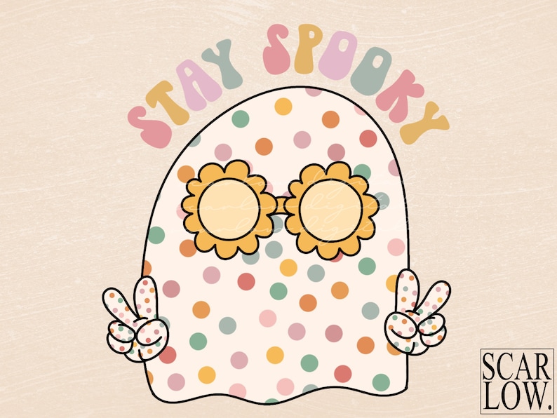 May include: A white ghost with colorful polka dots and sunglasses, wearing a peace sign on each hand. The text "STAY SPOOKY" is written in a rainbow arch above the ghost.