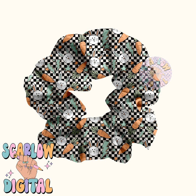 May include: A black and white checkered scrunchie with a pattern of green leaves, carrots, and white bunnies. The scrunchie is made of fabric and is designed to hold hair in place.