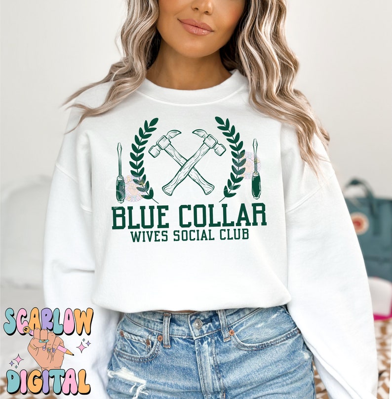 May include: White sweatshirt with a green graphic design of two crossed hammers, a wreath of leaves, and two screwdrivers. The text "Blue Collar Wives Social Club" is printed below the graphic.