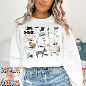 May include: White sweatshirt with a graphic of farm animals, including a cow, pig, chicken, sheep, duck, turkey, goat, donkey, and horse. The text "Farm Animals" is at the top of the graphic.