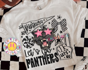 May include: White t-shirt with a graphic design featuring a black panther wearing pink star-shaped sunglasses. The shirt includes the text "Let's Go Panthers" and various star and bow accents. A football is visible in the background.