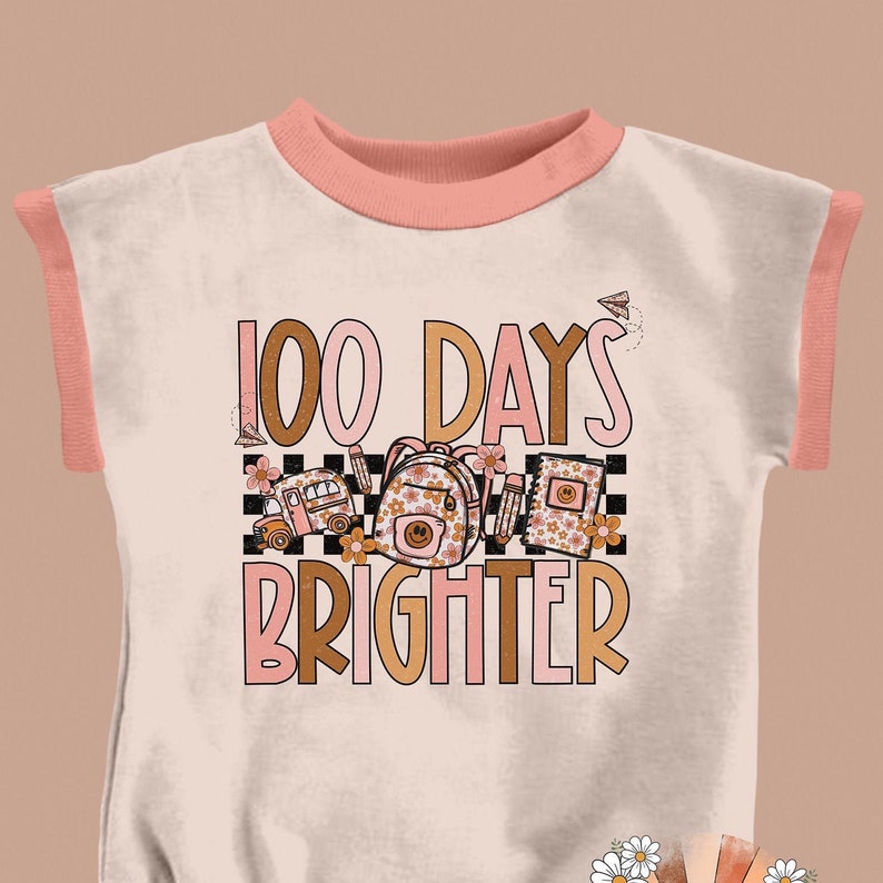 May include: A pink and white t-shirt with a graphic design that says "100 Days Brighter" with a school bus, backpack, and books.