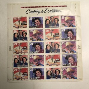 May include: A sheet of 20 Legends of American Music Series postage stamps featuring Country & Western artists. Each stamp is valued at 29 cents and depicts Hank Williams, Patsy Cline, The Carter Family, or Bob Wills with their names and USA text.